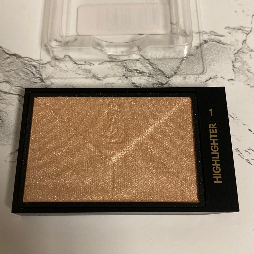 NWOB YSL couture highlighter #1
Never used
Sold in pan 
No compact
No box
